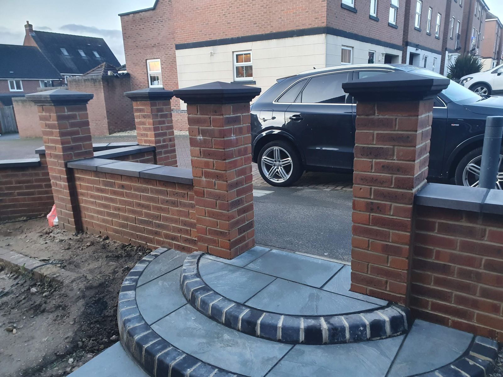 New block paving driveway with steps and pillars