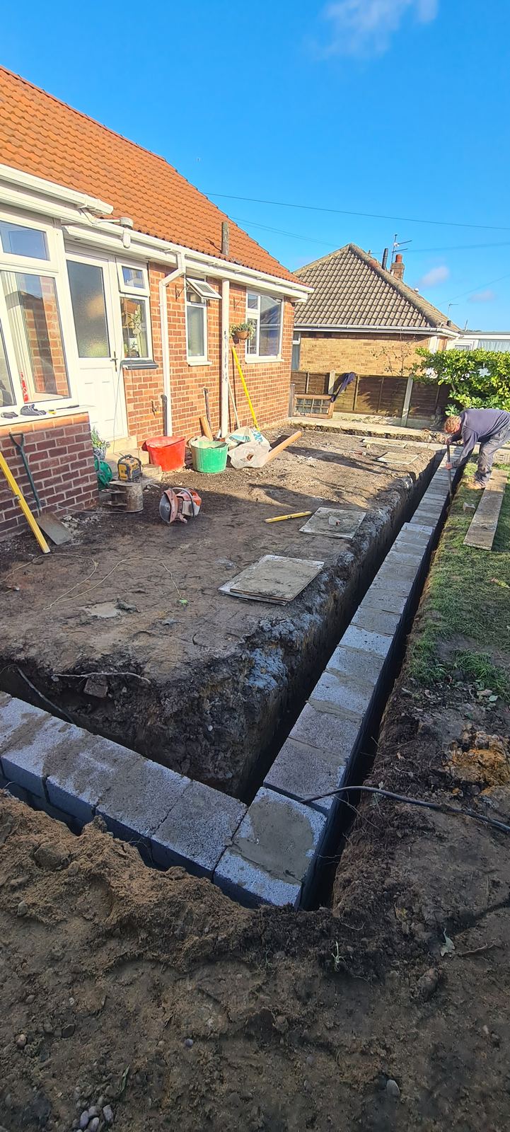 footings dug and the first blocks going in, before the inspection