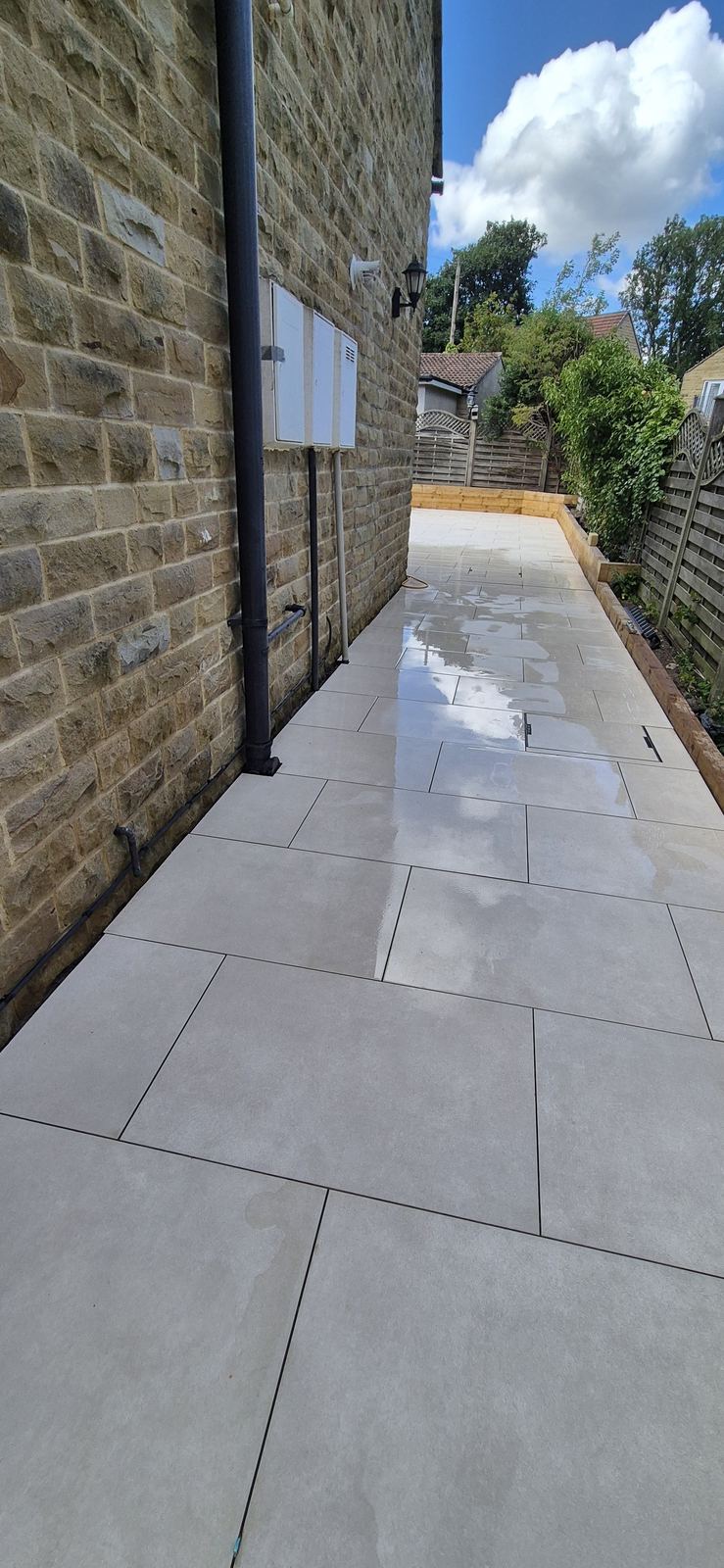 porcelain path down the side of the house, same tile, same levels
