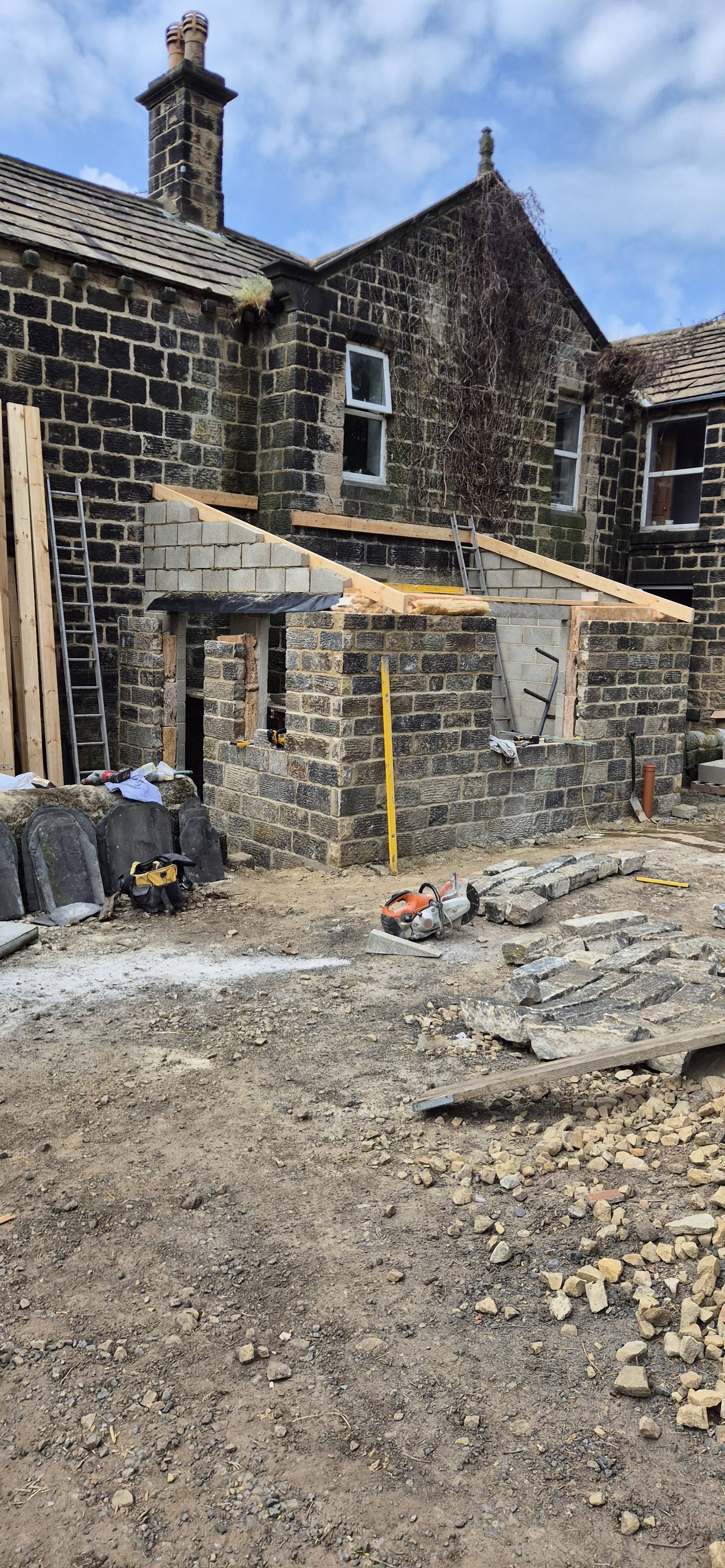 the reclaimed stone outer leaf going up on the extension shell