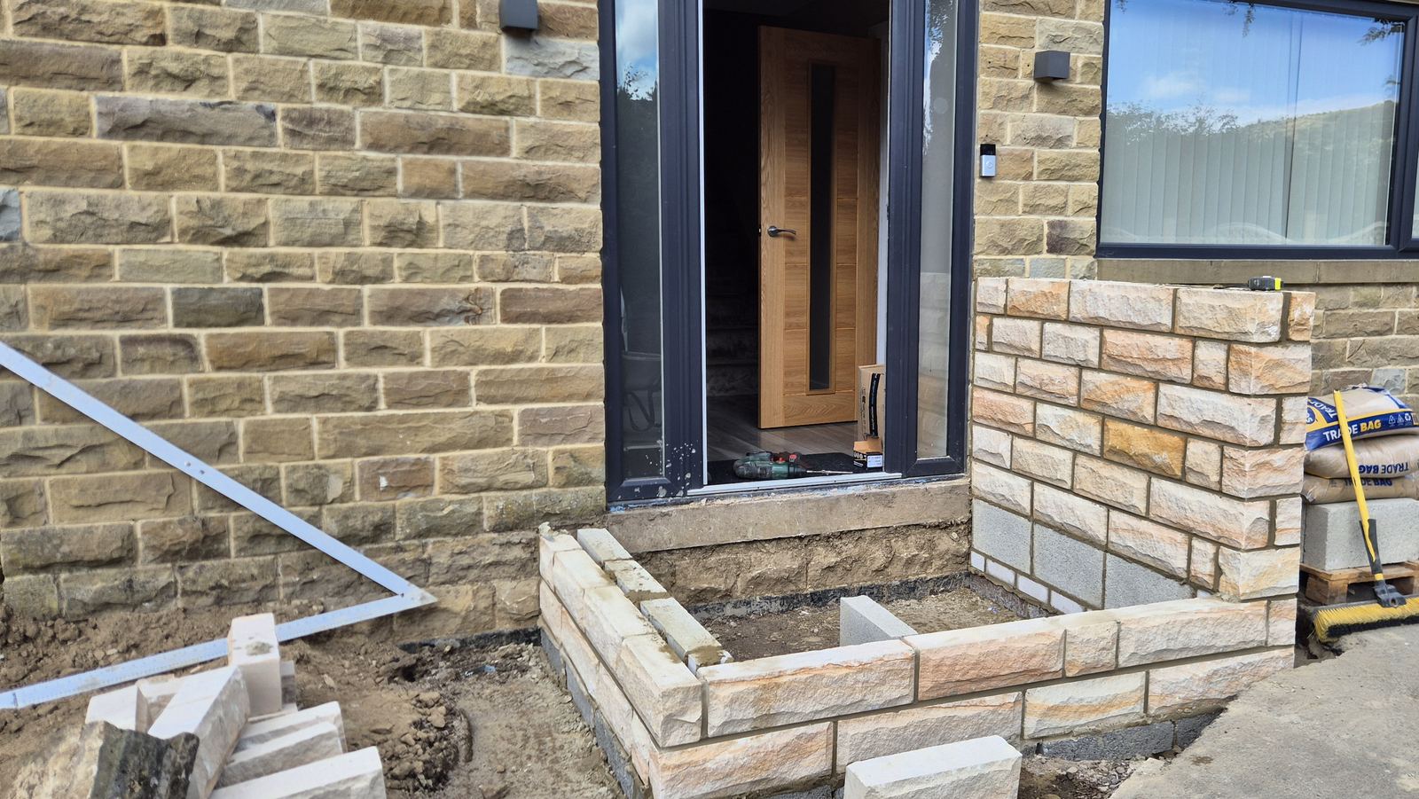 the stone dwarf walls and pillars built up, ready for the porch posts