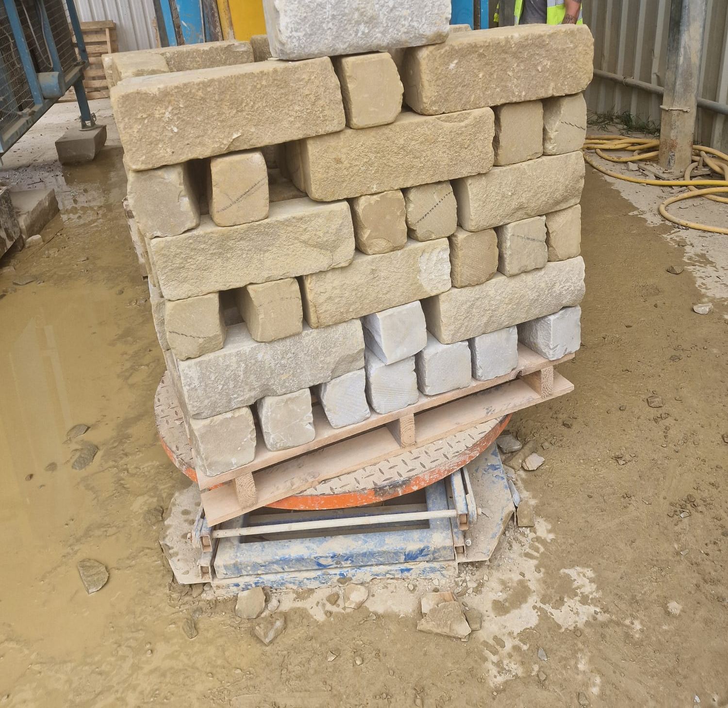 cut walling stone stacked on a pallet at the stone yard